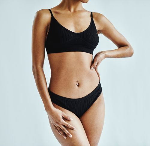 Woman receiving a rejuvenating facial treatment at a spa, promoting skin care and relaxation.